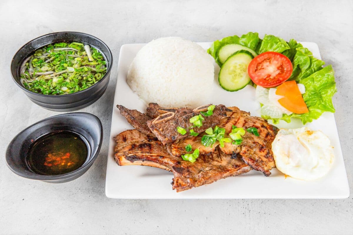 200. House Special Rice (Grilled Pork Chop, grilled Chicken, Beef Short Rib, and Fried Egg) (Cơm Đặc Biệt)