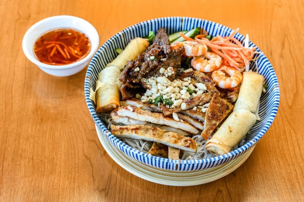 Grilled Pork, Chicken, Shrimp and Spring Rolls Bowl