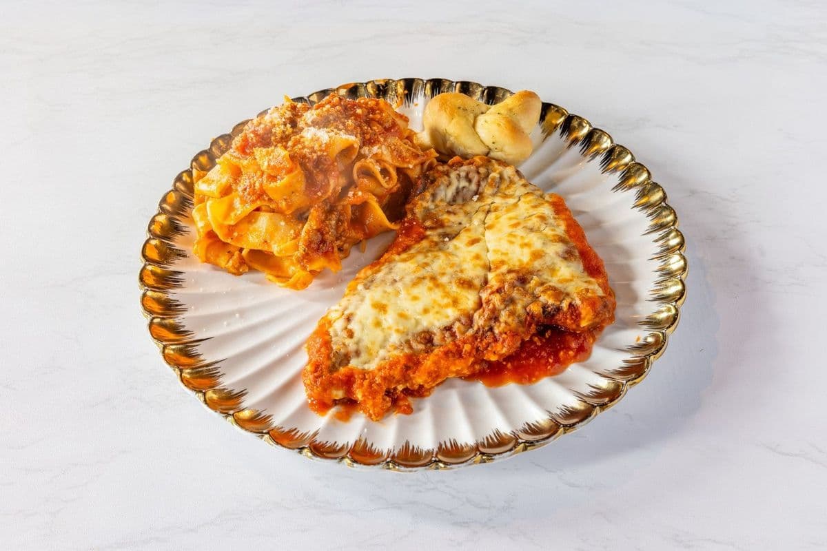 Chicken Parmesan served with Spaghetti Meat Sauce