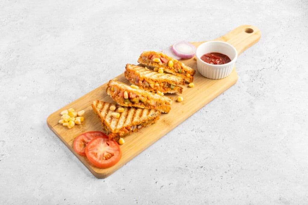 Schezwan Veg Club Sandwich