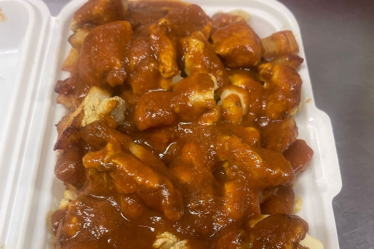 P5. Butter Chicken Poutine