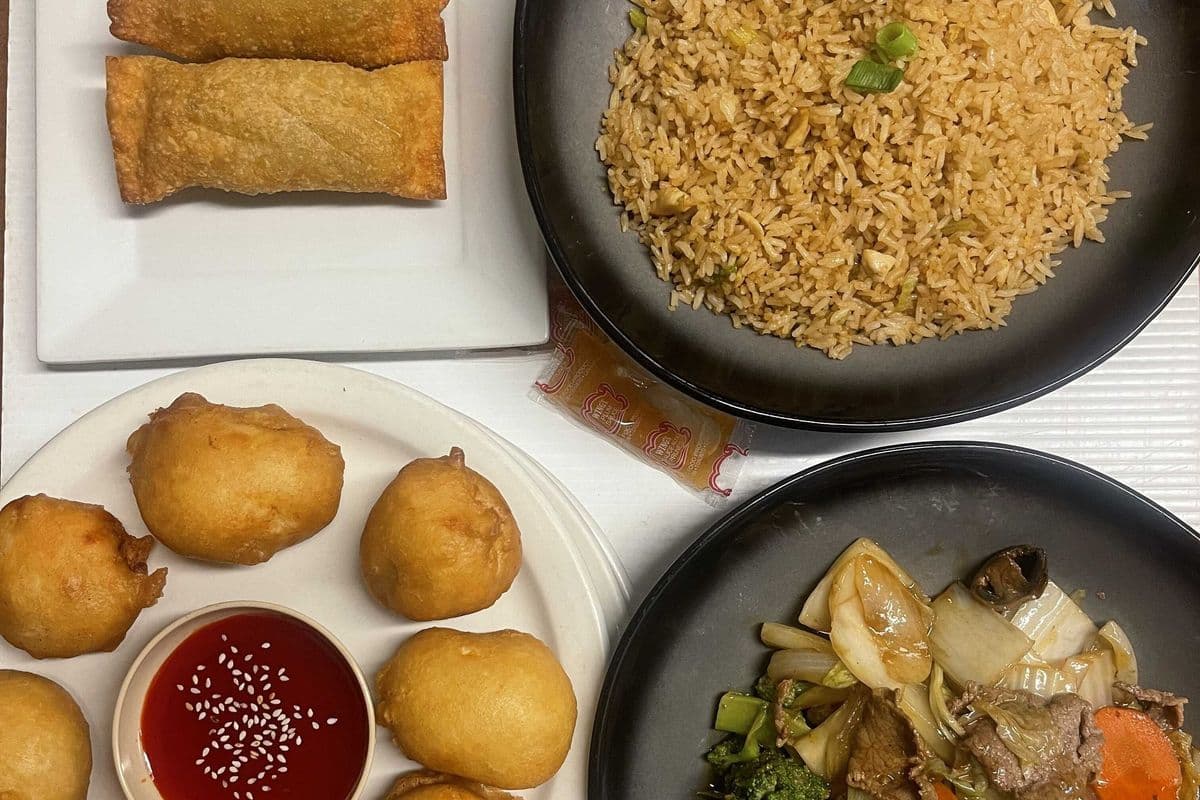 Dinner 2 (Two egg rolls, (8) chicken balls, beef greens, and 1 rice, 8oz sauce)