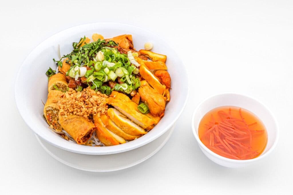 33d. Grilled Pork, Chicken and Two Spring Rolls on Rice Vermicelli