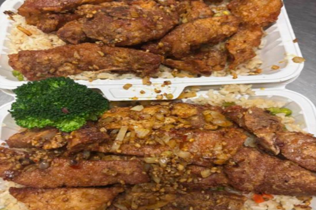 BOGO - Salty peppery pork chop with fried rice , spicy (with spring rolls) 椒盐猪排饭