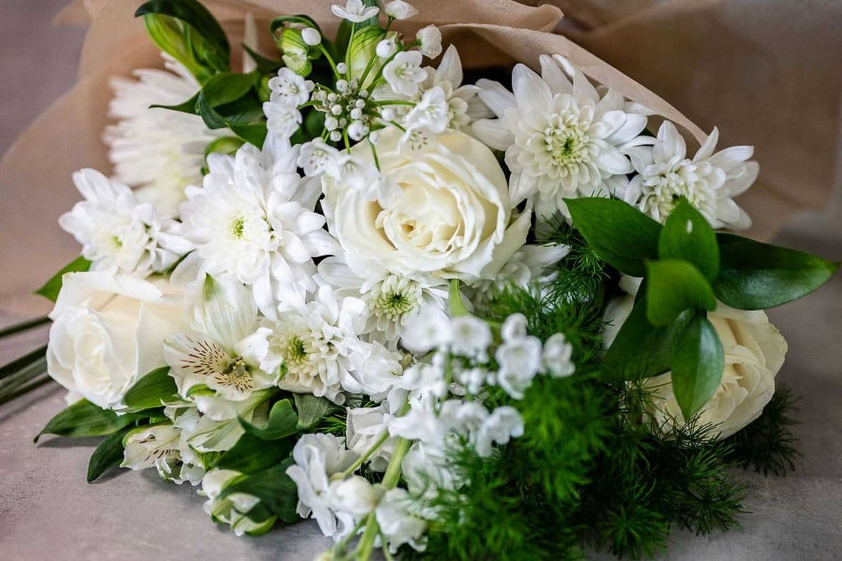 Pure -Hand tied bouquet of all white flowers - size Note