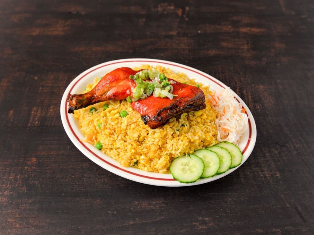 57. Fried chicken Leg on fried rice