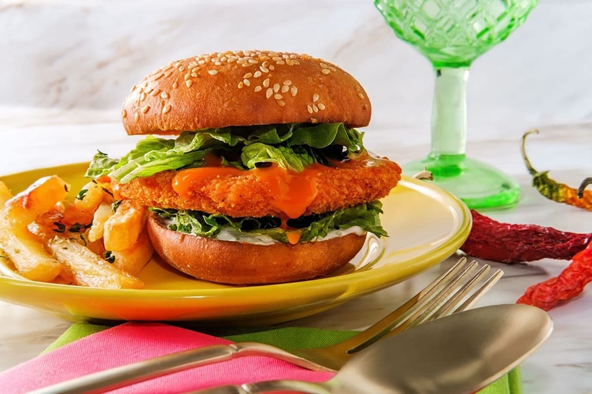 Crispy chicken buffalo bacon cheese burger with fries
