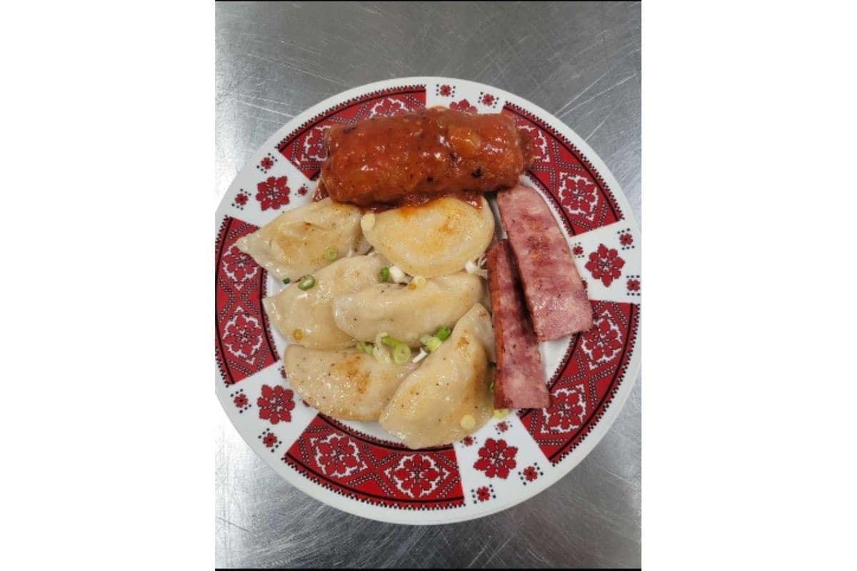 Six Perogies, One Cabbage Roll, 1/2 Sausage and Side of Sour Cream