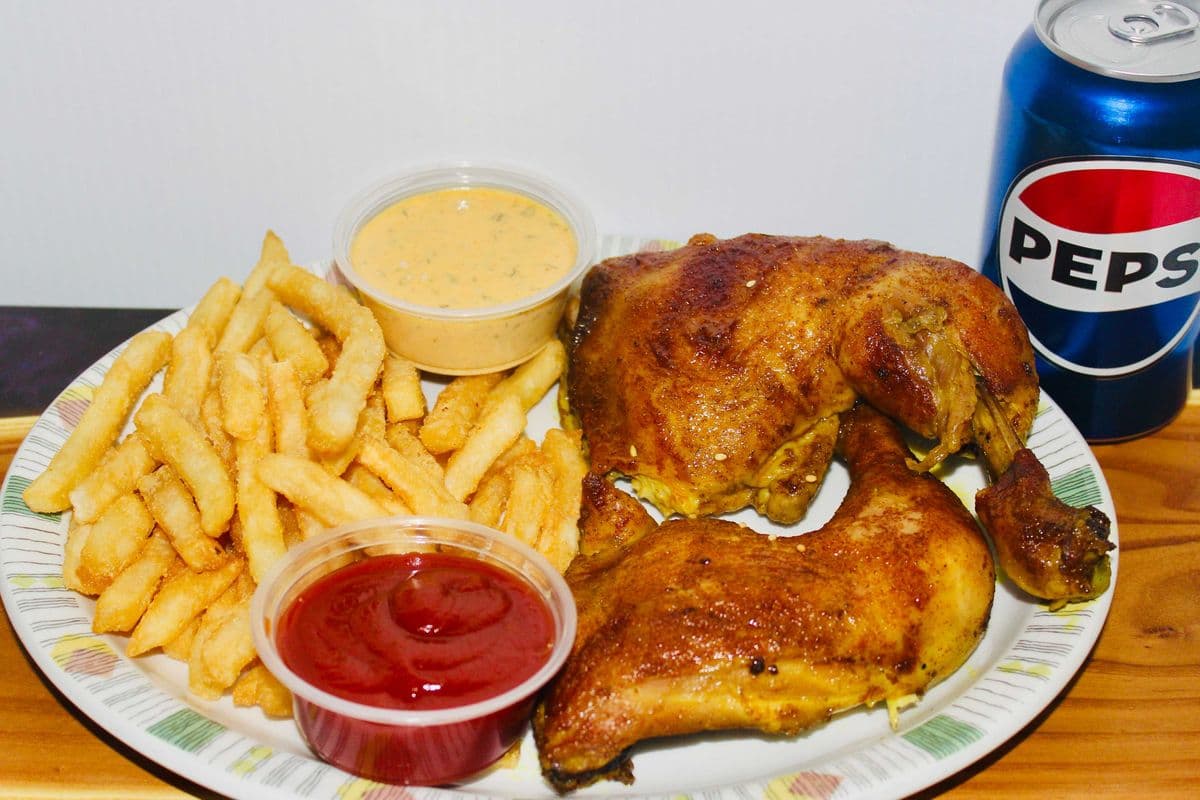 Two Chicken Leg quarters, Fries, and a can of pop