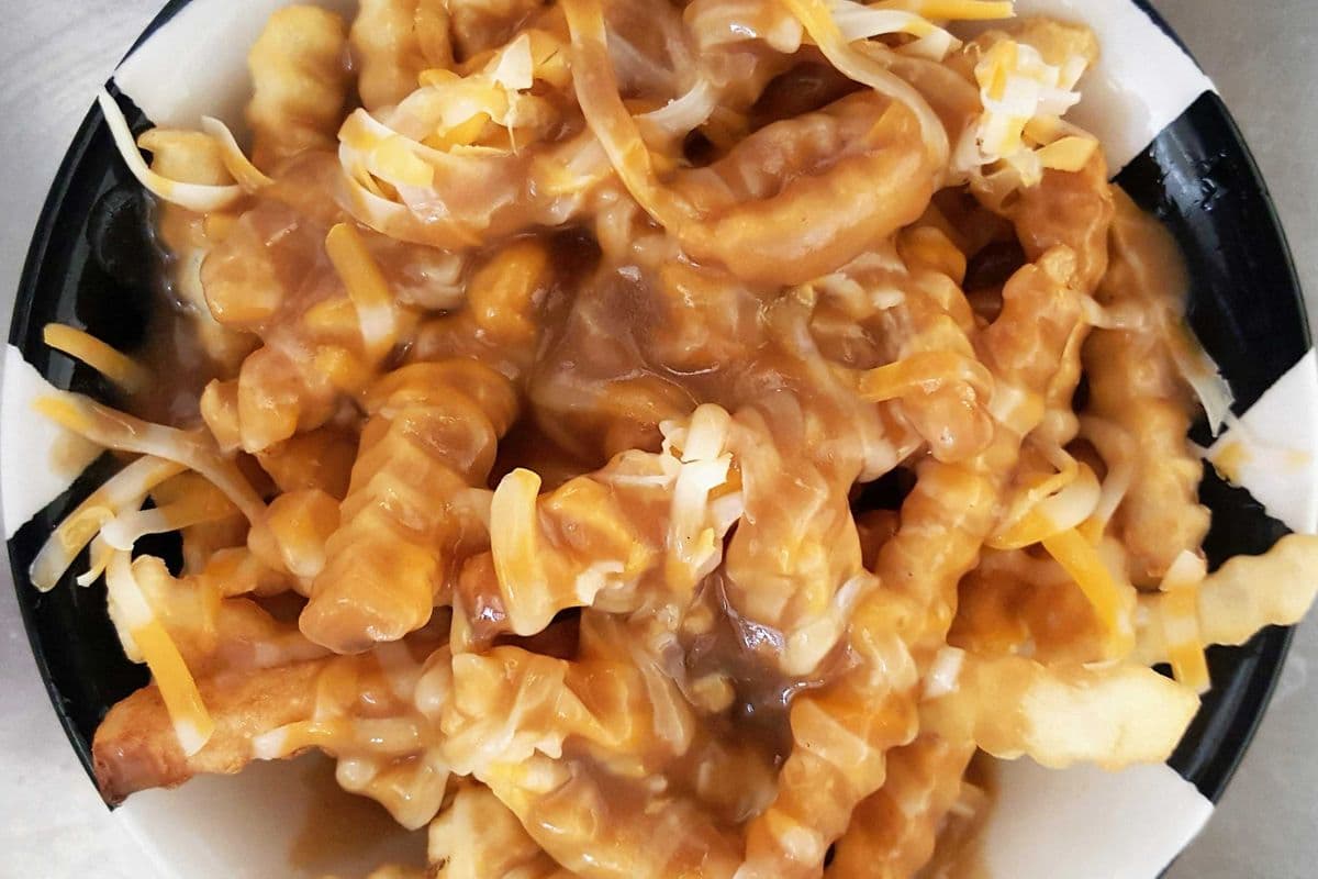 Poutine (Shredded marble cheddar cheese & homemade gravy, not a cheese curd)