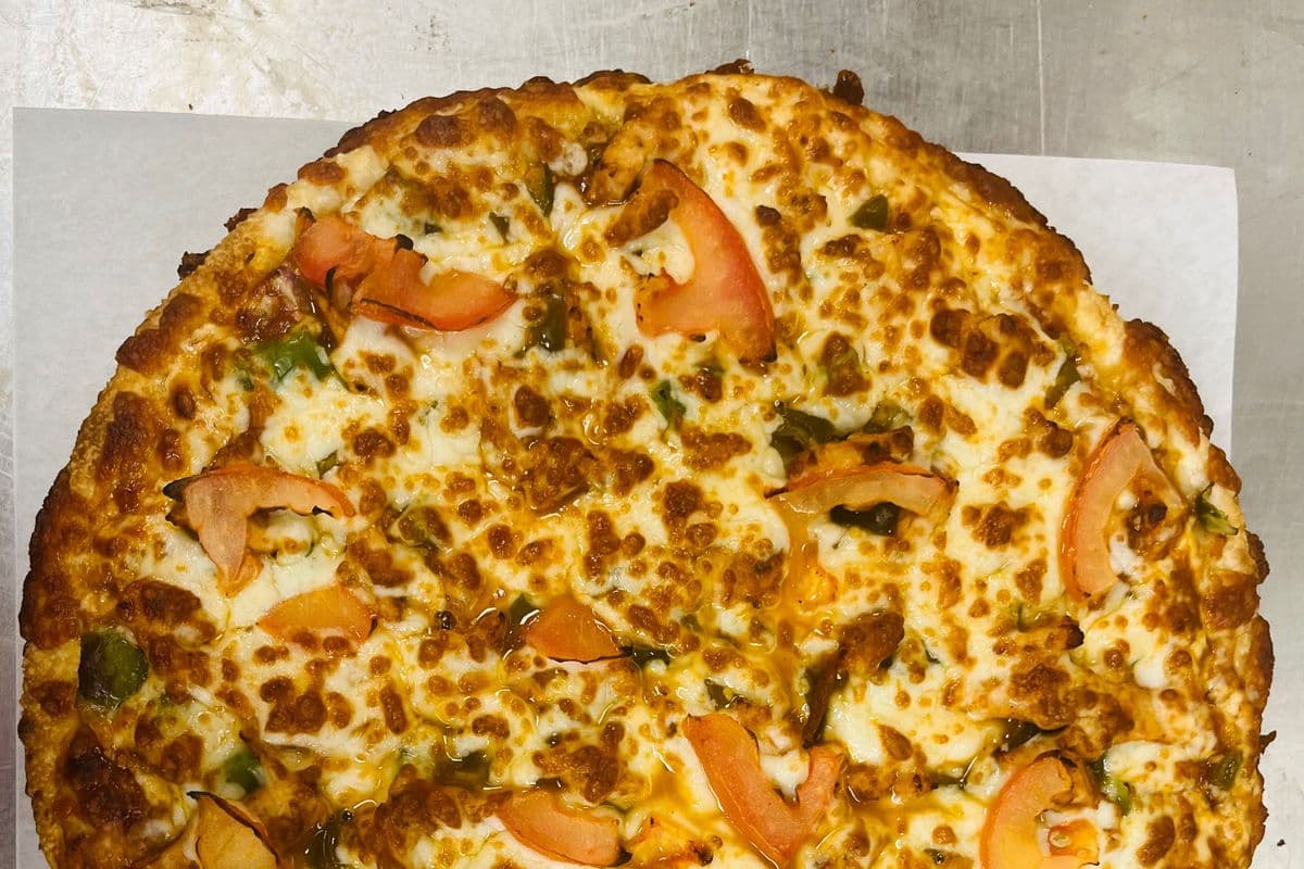 10" Butter Chicken Pizza and Choice of Second Pizza