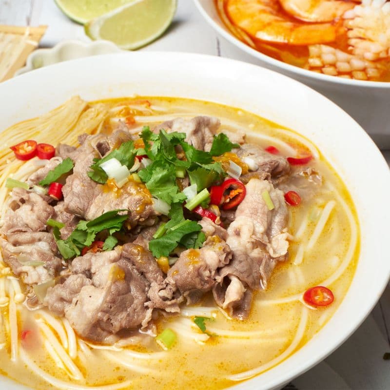 Spicy and Sour Rice Noodle Soup with Beef and Enoki Mushroom
