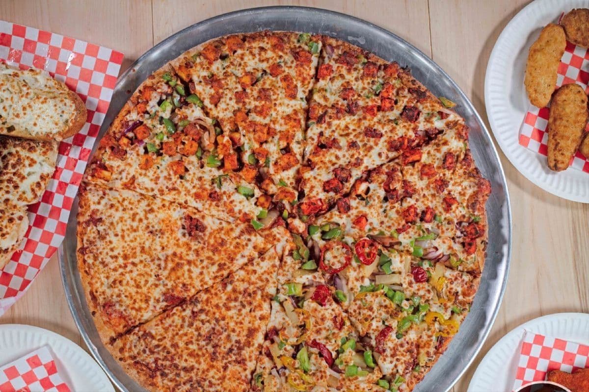 Mr. Singh's Singles (1 Large Pizza, 4 Toppings, 1 Dip, and 1 Pop)