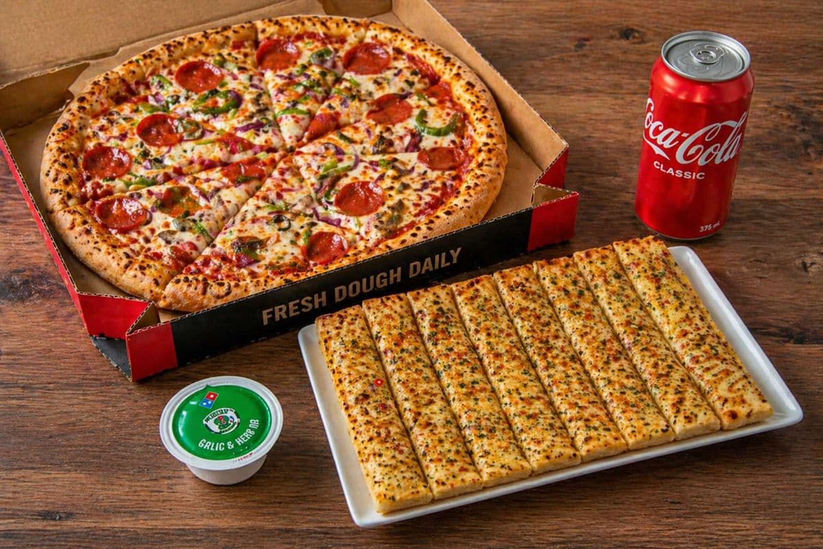 Any 12" Pizza with 12" Garlic Finger with Dip and a Can of Pop