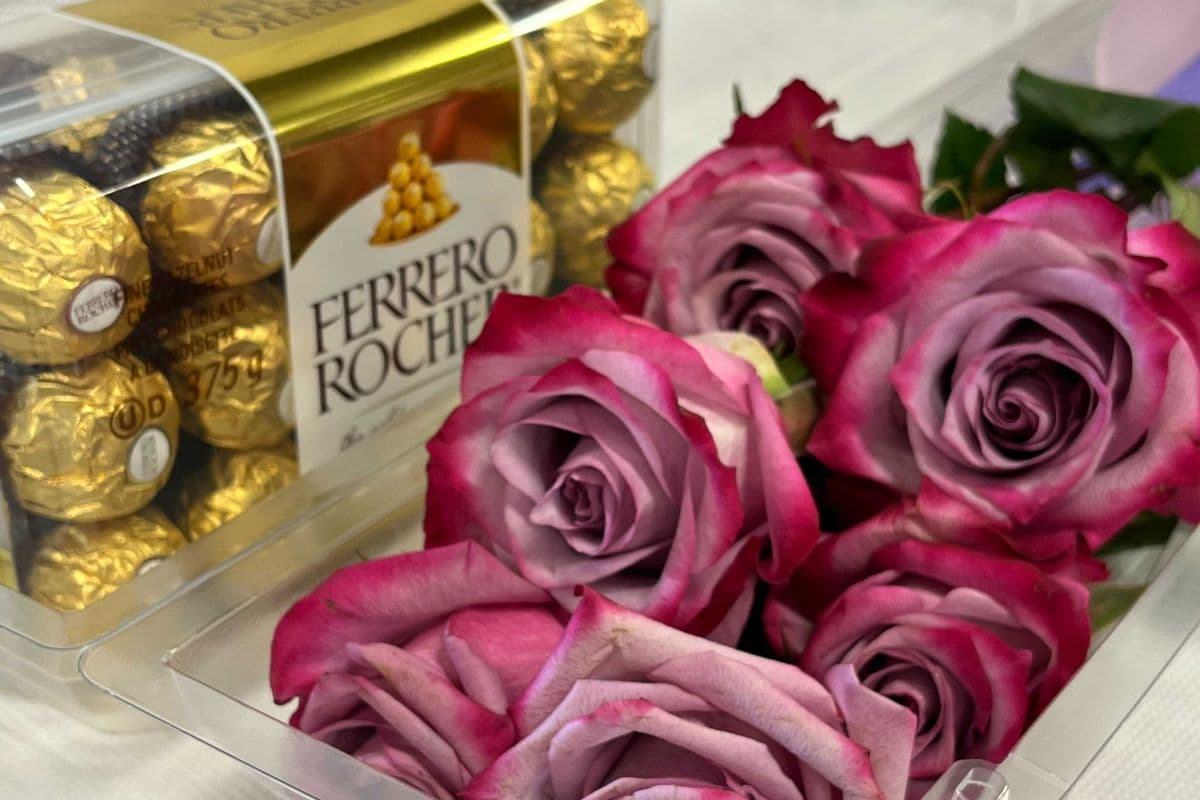 Six Purple Roses in Clear Box with Chocolate