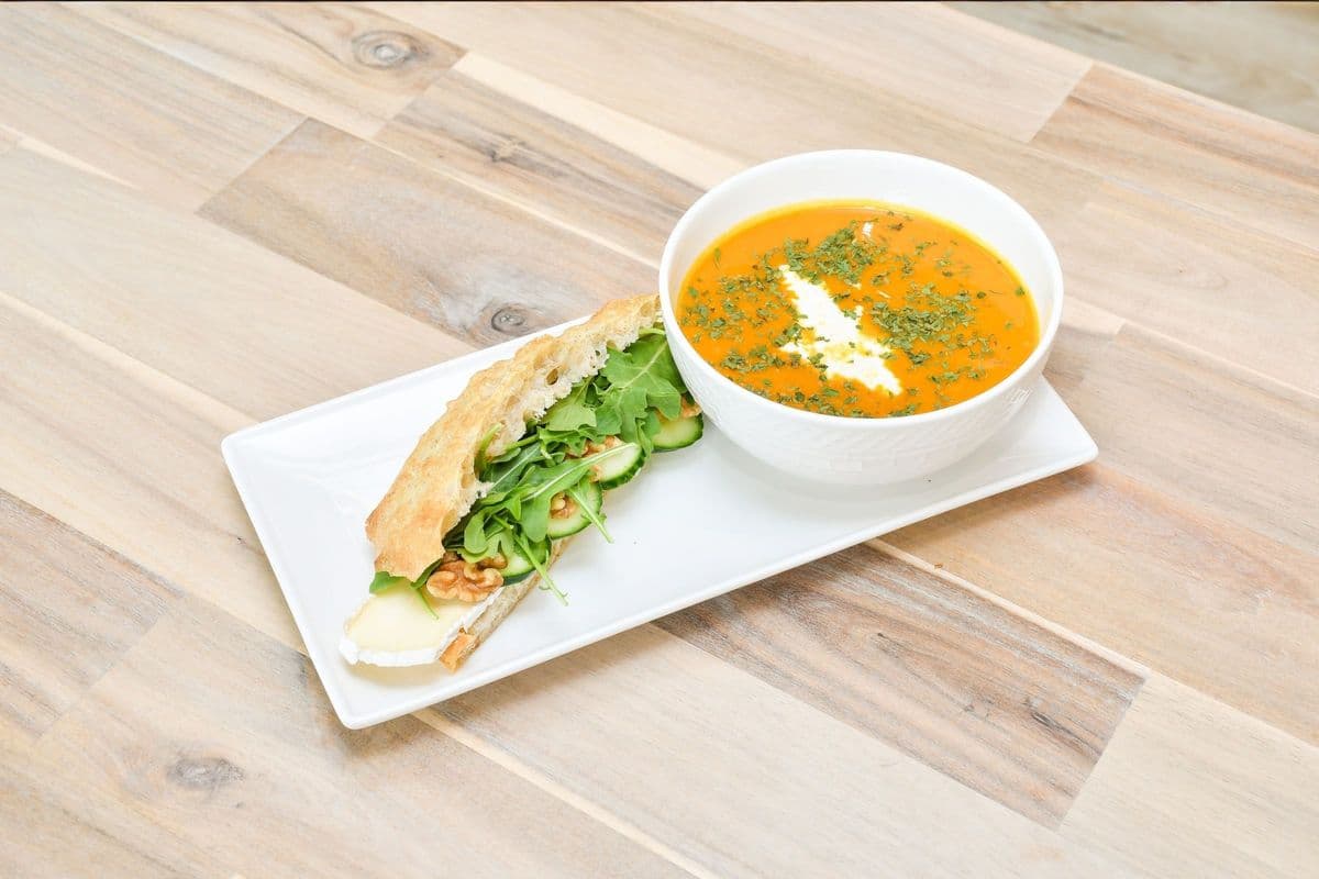 A Bowl of Soup of the Day and Half Sandwich