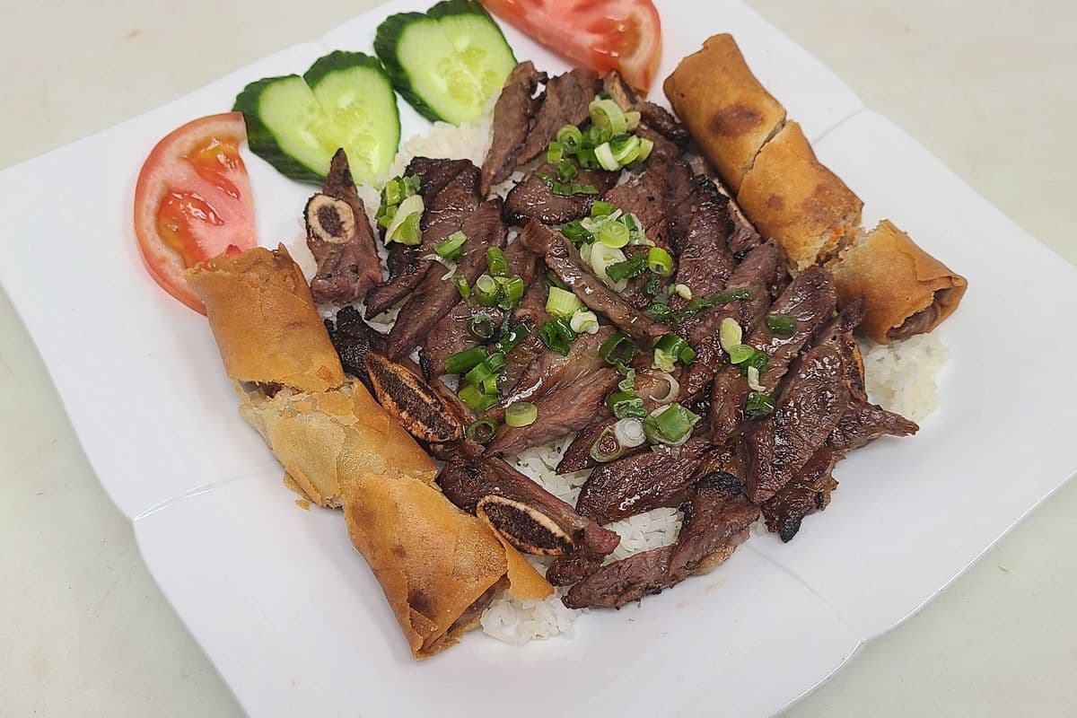 42a. Charbroiled Beef Back Ribs and Spring Rolls on Steamed Rice