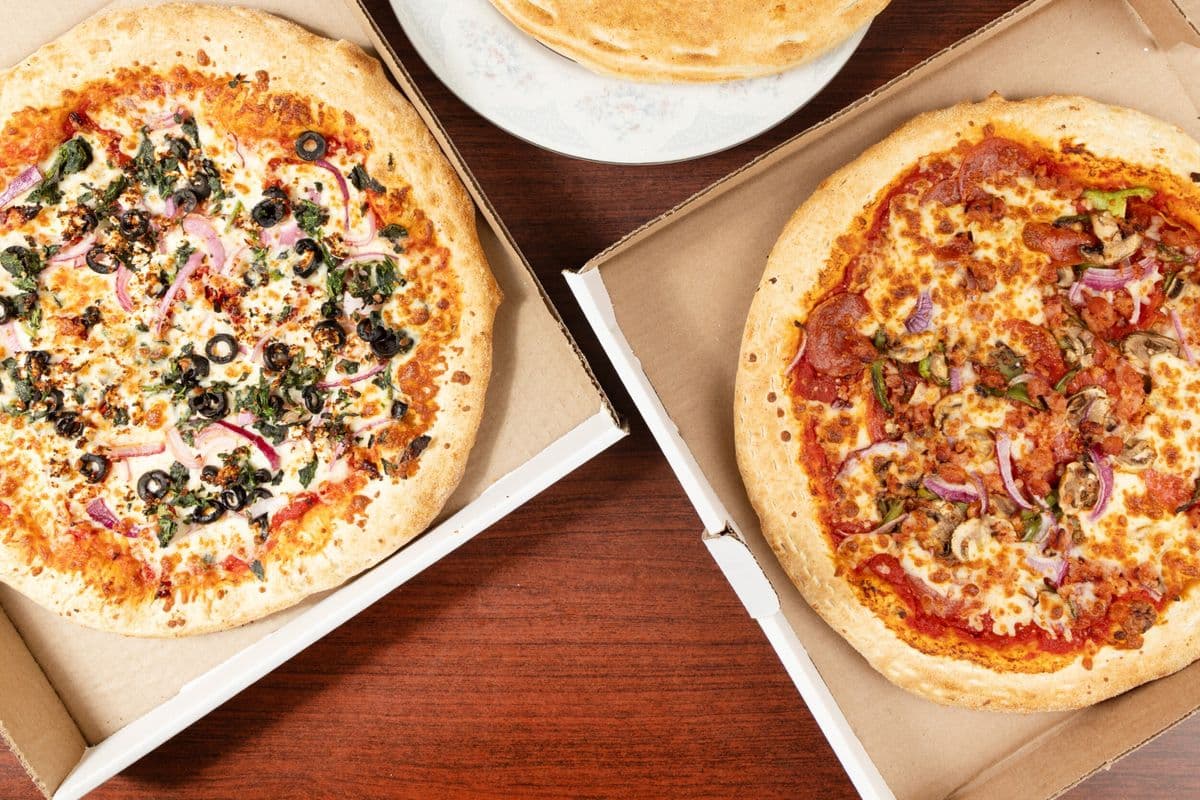 Family Deal Two - Two Extra-Large Pizzas with Three Toppings Each, Ten Wings, Four Pops, Two Dips, and Wedges