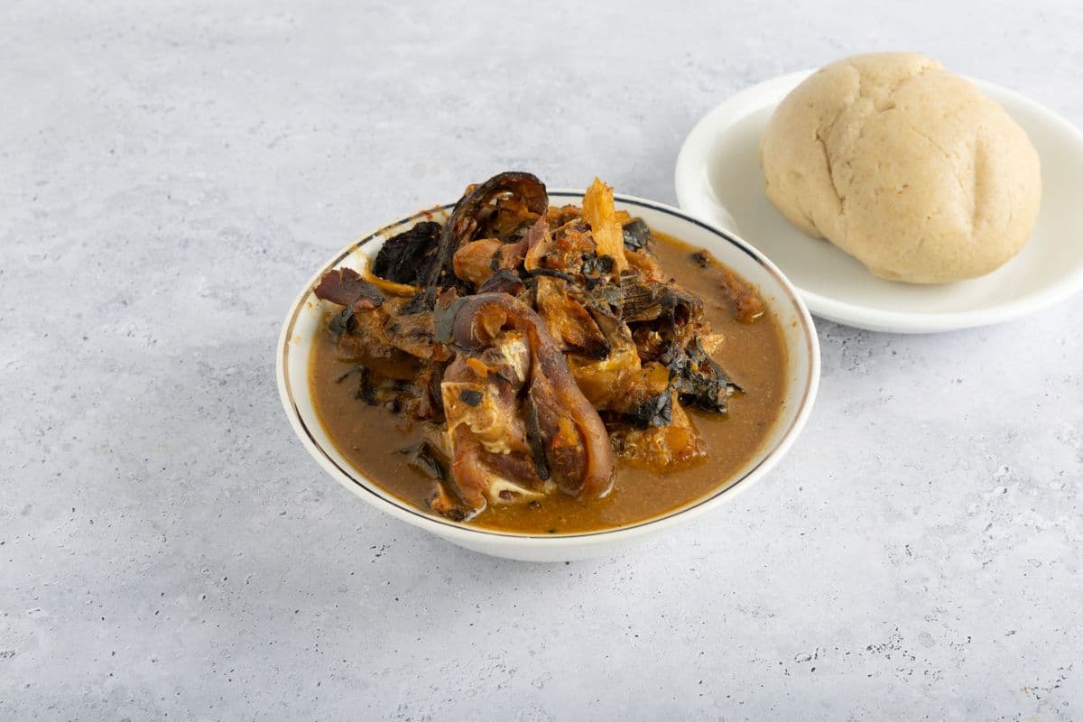 White (Nsala) Soup with Goat Meat and Pounded Yam Or Oatmeal Or Garri