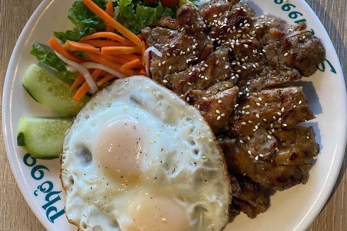 68. Rice with Lemongrass Pork Chop and Two Eggs Sunny-Side Up