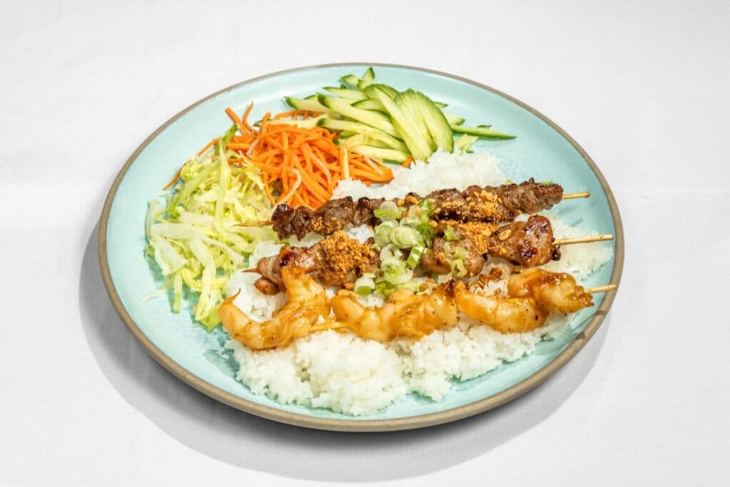 R85. Grilled Shrimp, Chicken and Beef Skewers on Rice