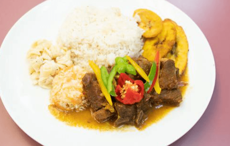 Curry Goat and Rice (+ coleslaw & Mac salad)