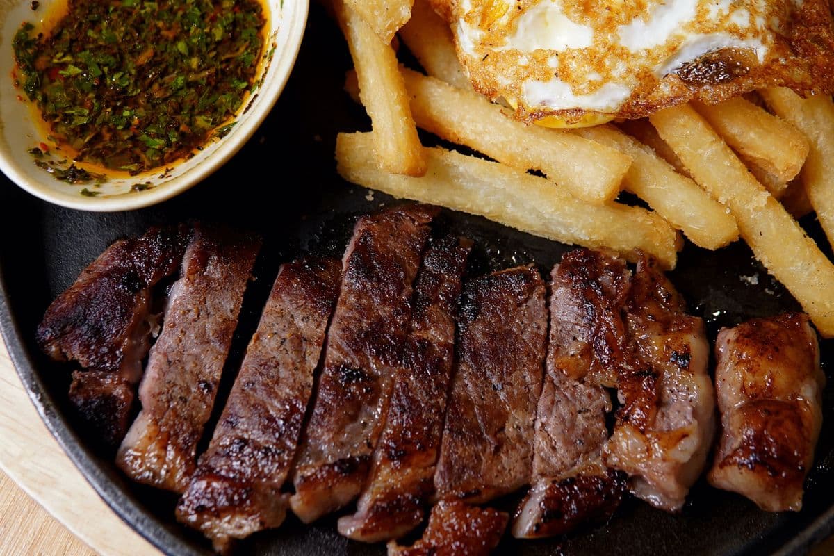 Steak And Egg (juicy steak + yuca fries + fried egg + chimi)