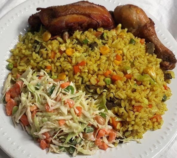 Fried Rice and Salad with Two Pieces of Meat or Fish