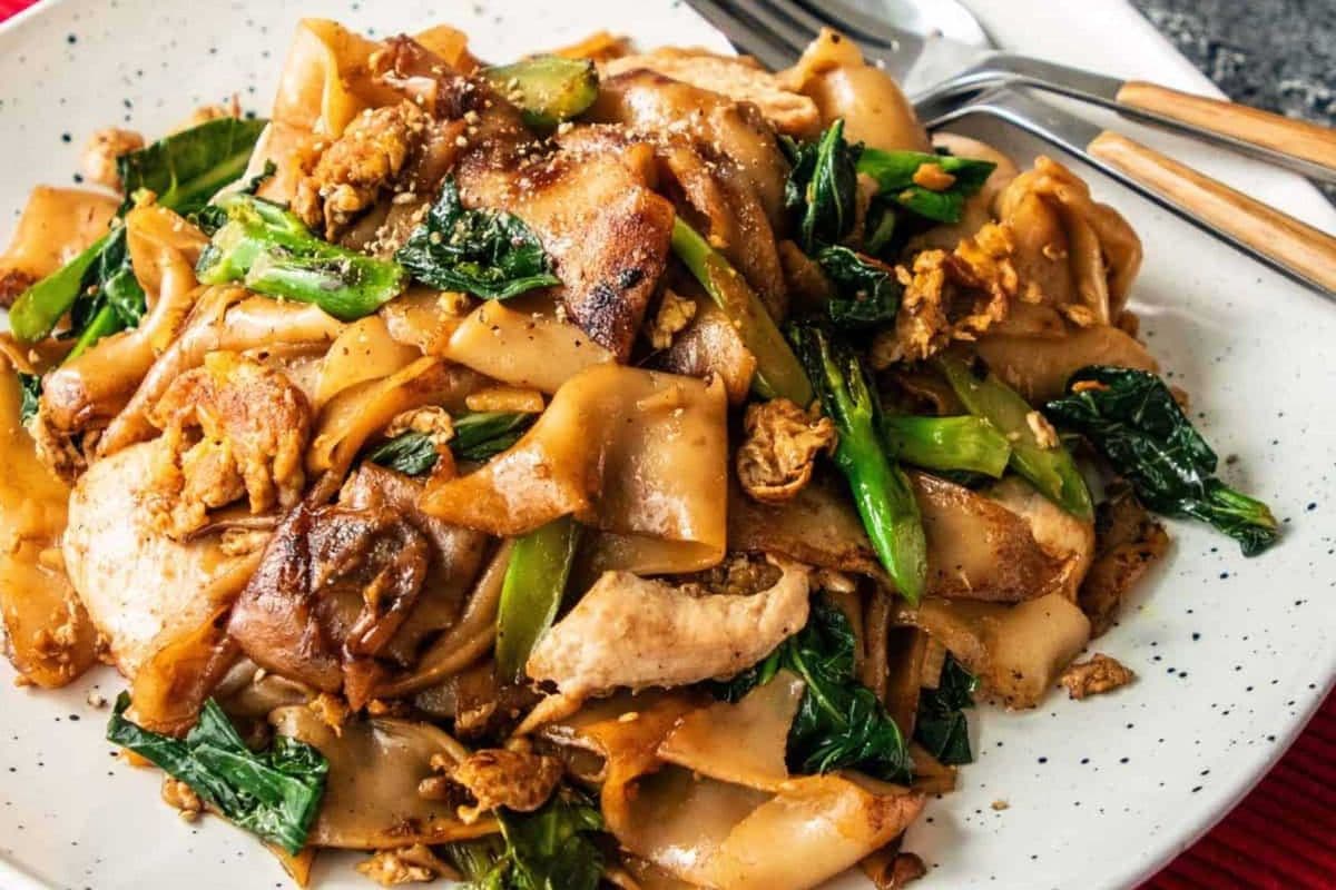 Pad See Ew (Thai Rice Noodles) (protein, white onions, wide rice noodles, one egg, Chinese broccoli)