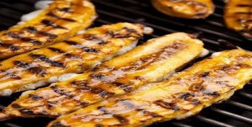 Grilled Ripe Plantain and Tilapia Fish with Two Pieces of Meat or Fish