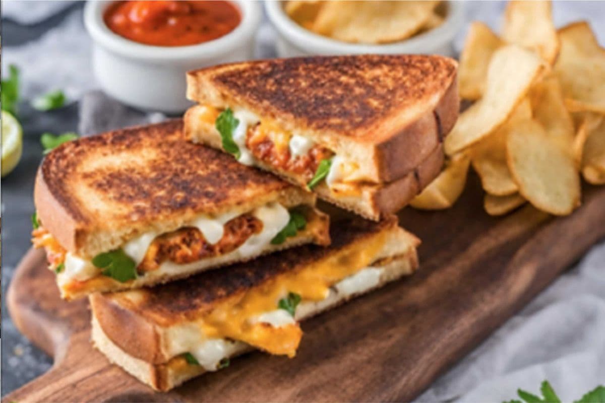 Tandoori Chicken Grilled Cheese Club Sandwich (served with potato chips)