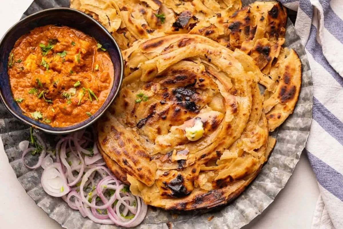 Tawa Lacha Paratha with Dahi and Chana