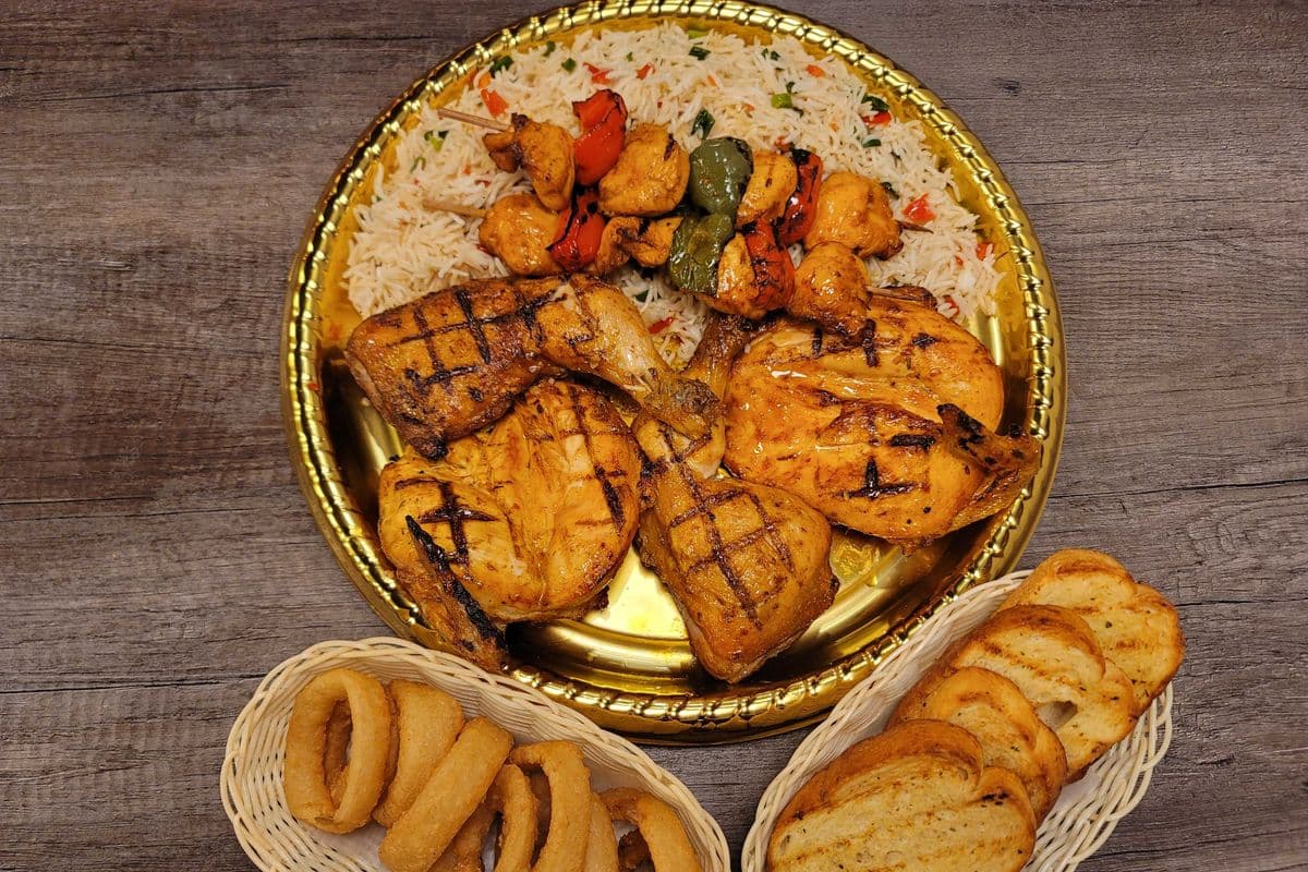 One whole Char-Grilled Chicken + 2Skewers + 2Large Sides+4 Garlic Breads