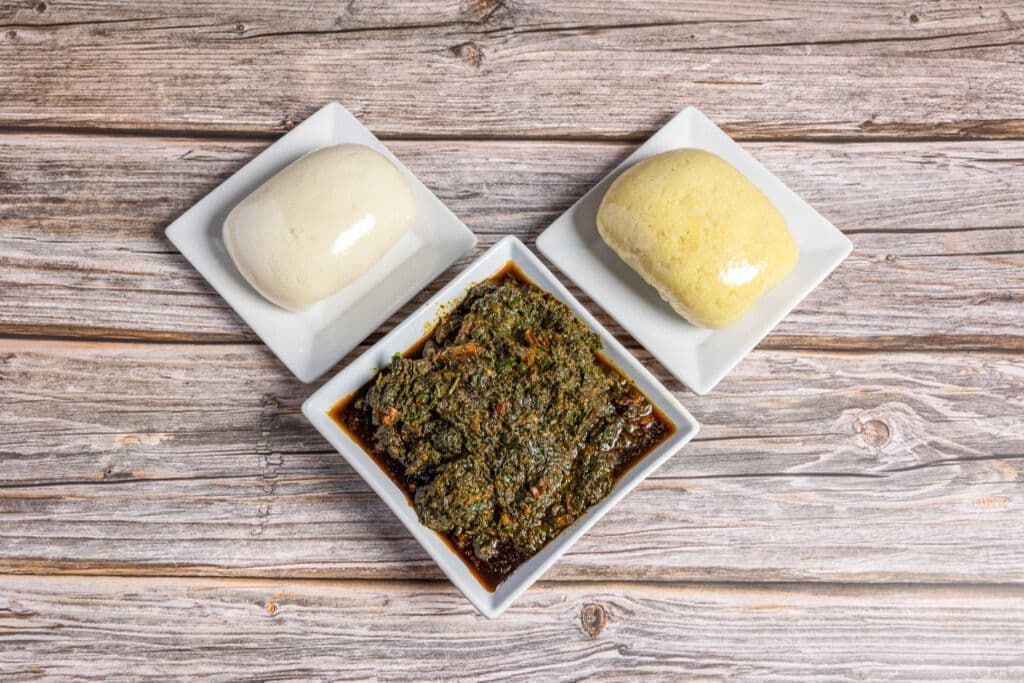 Vegetable Soup - Edikang Ikong (Assorted Meat) and Poundo Yam(fufu) with Yellow Garri