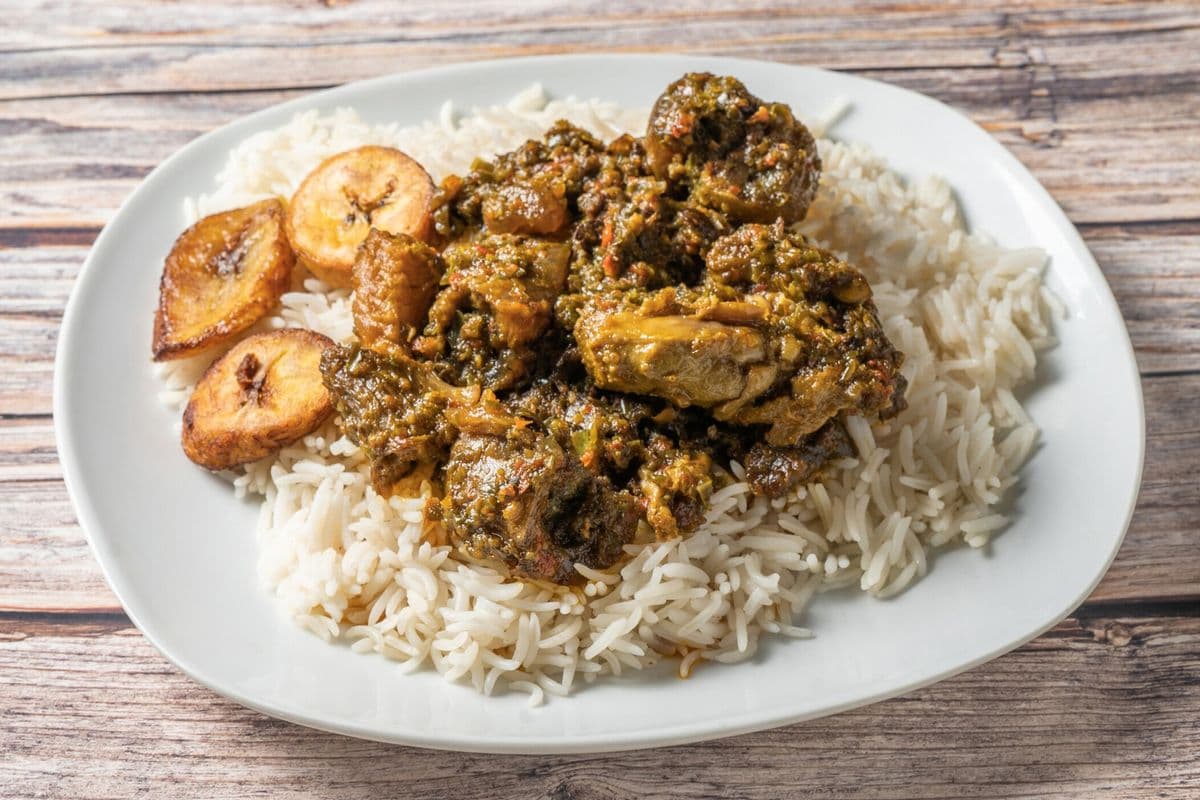 White Rice And Plantains With Ayamase Stew And Goat Meat And Assorted Proteins