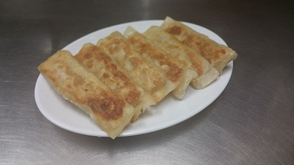 909. Pan-Fried Pork Dumplings (6 pcs)