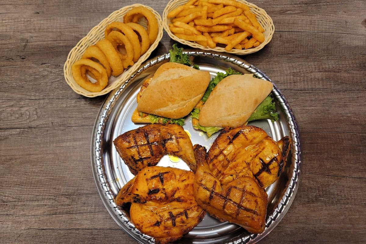One Whole Char-Grilled Chicken + 2 Chicken Fillet Sandwiches + 2 Large sides + 2 Garlic Breads + 2 Cans