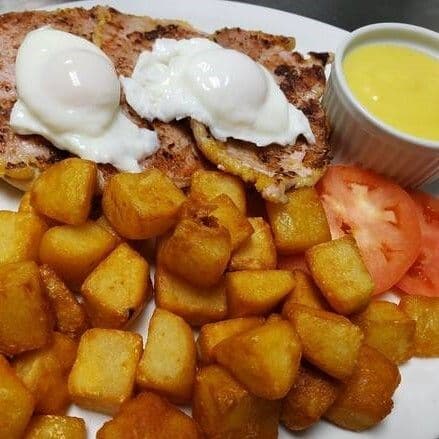 Eggs Benedict with Peameal and Wedge Fries