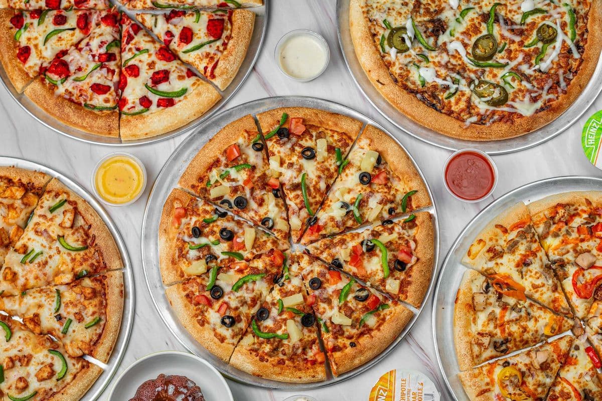 Any Two Medium Pizza with Wings (8 pcs), Four Can Pop, and Two Dips