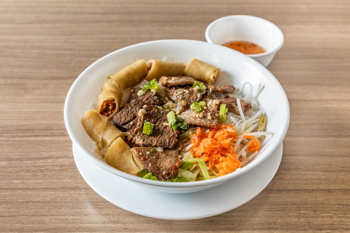 33. Charbroiled Pork, Beef, Chicken, and Spring Rolls on Vermicelli