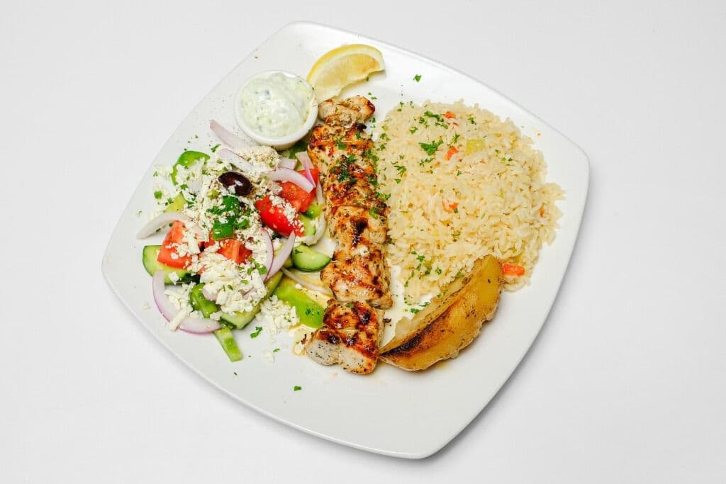 CHICKEN SOUVLAKI- 8-9 oz chicken breast. Comes with choice of roast potatoes and Greek salad- OR- Rice, roast vegetables-potato