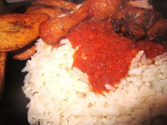 White Rice with Two Pieces of Meat or Fish with Dodo, Moi Moi, or Salad