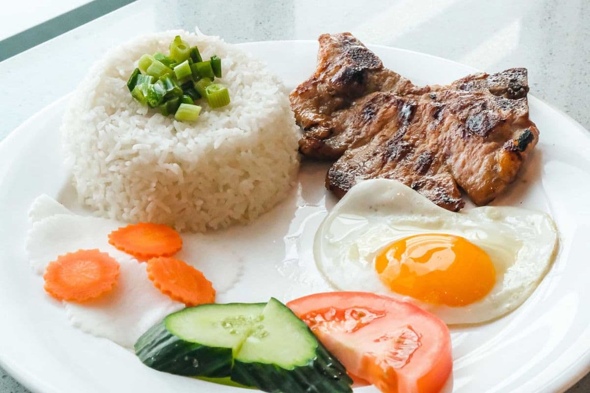 43. Charbroiled Pork Chop and Sunny-Side Up Egg on Steamed Rice