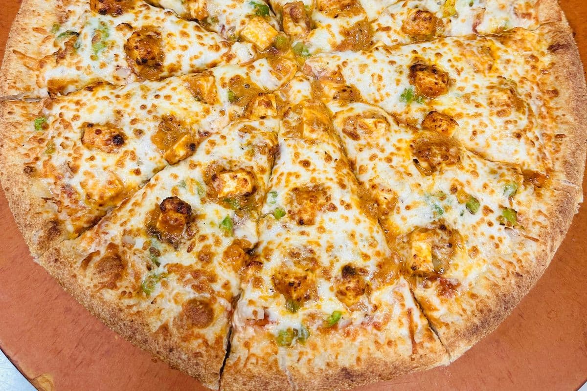 9. Large Butter Chicken or Paneer Pizza. Select option (14 Inch)