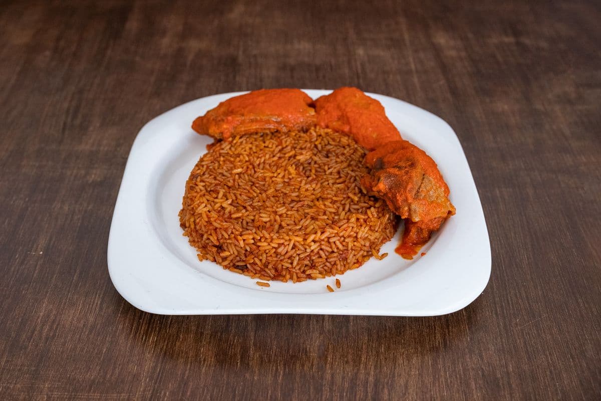 Smokey Jollof Rice Served with Fried Chicken