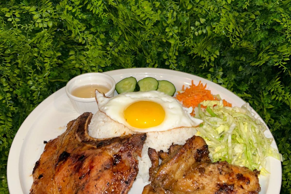 31. Charbroiled Boneless Chicken and Pork Chop Topping with a Fried Egg