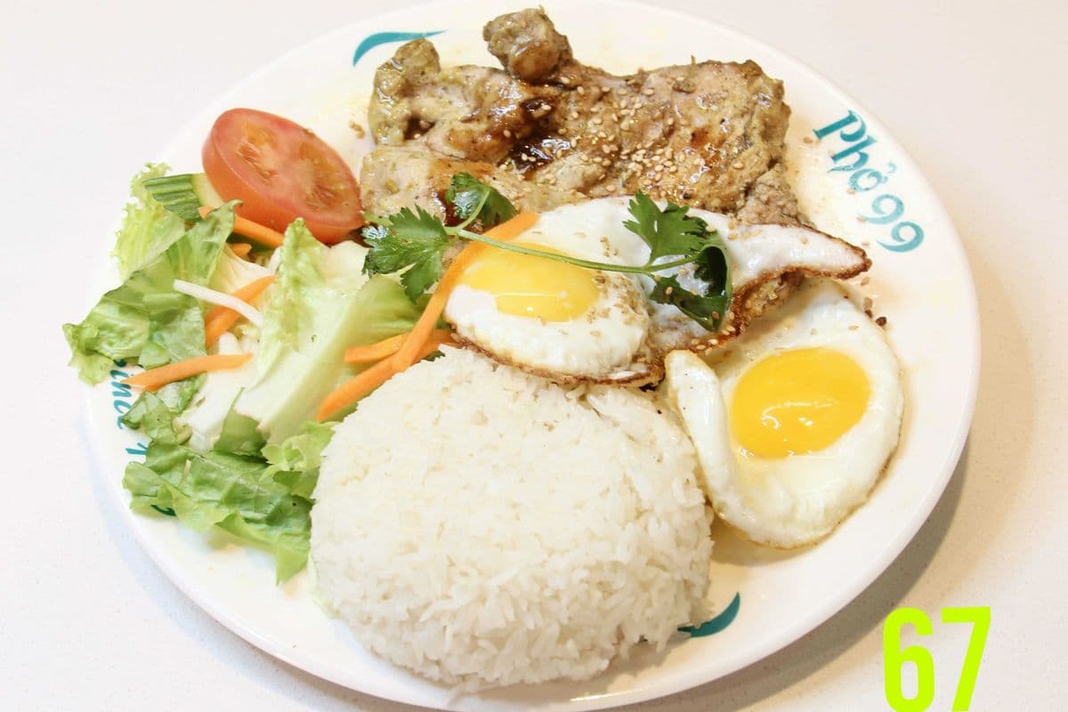 67. Two Sunny-Side Up Eggs with Grilled Lemongrass Chicken on Rice