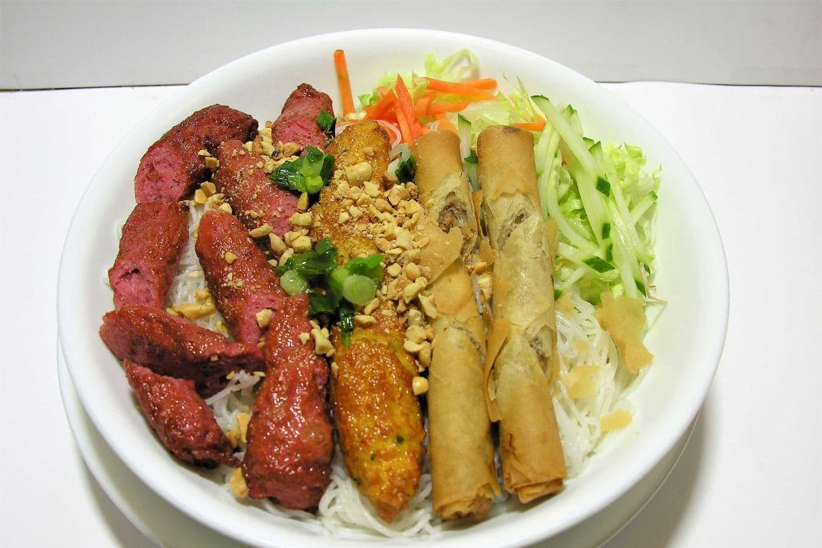 23. Vermicelli with Charbroiled Shrimp Sausage, Ground Pork Sausage and Spring Rolls "Replace Rice or Vegetables Add $1.00"