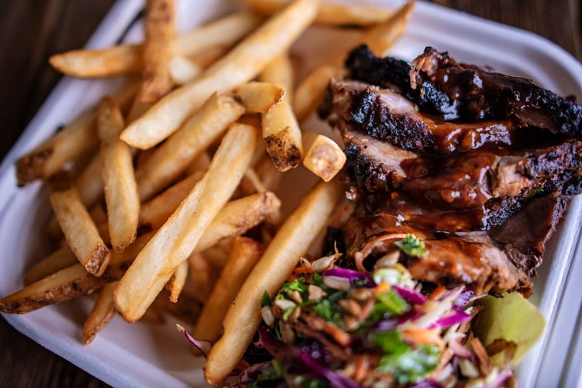 Jerk Pork with Fries and Kale Slaw