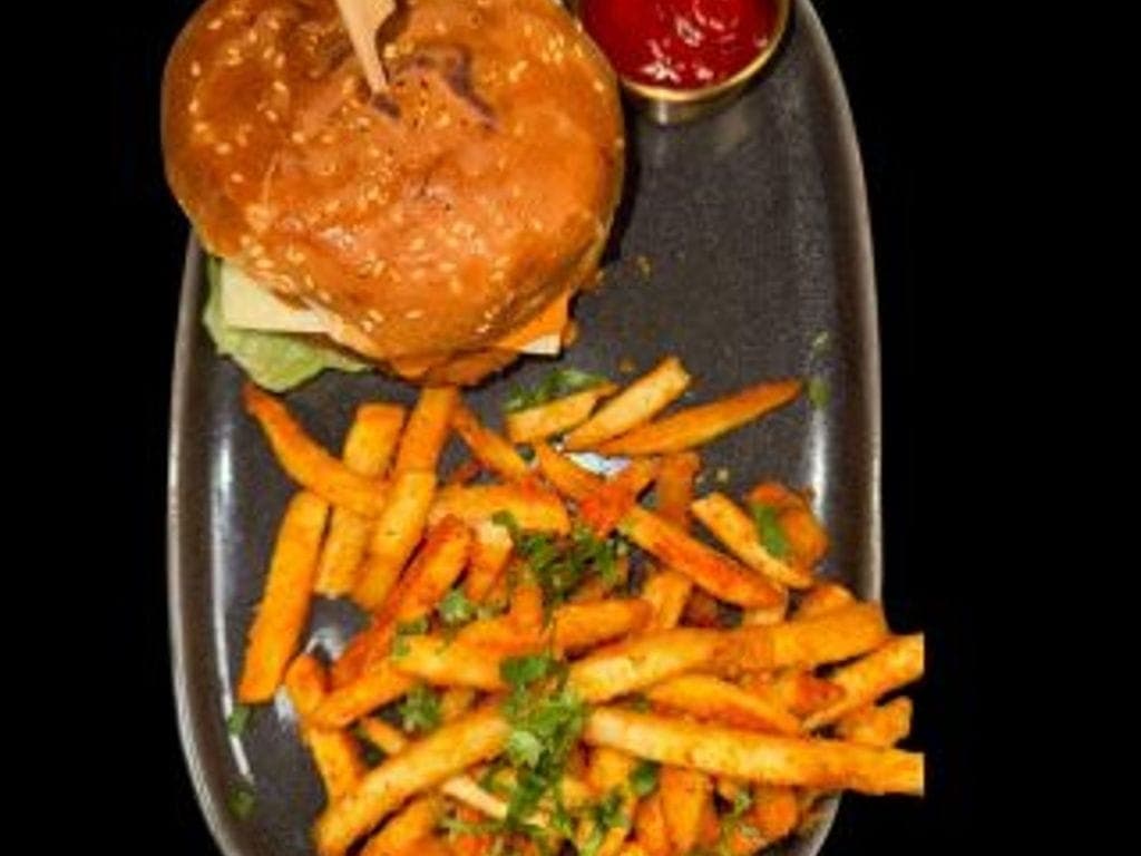 Veg Burger with peri-peri fries and pop.